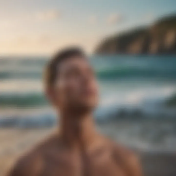 Person practicing deep breathing exercises by the ocean