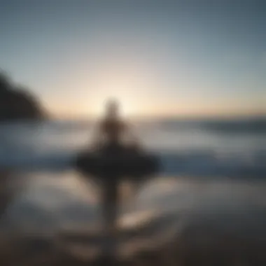 Person meditating by the ocean