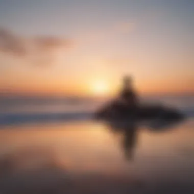 Person meditating on a peaceful beach at sunset