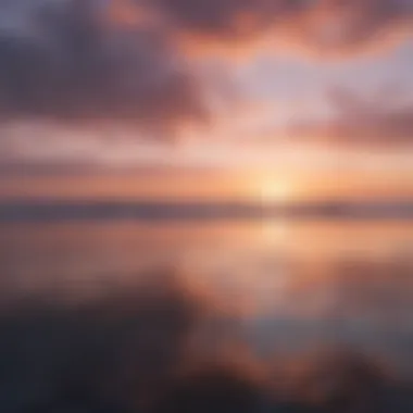 Soft pastel sunset over calm water reflecting sky