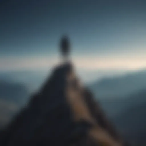 Silhouette of a person standing atop a mountain peak