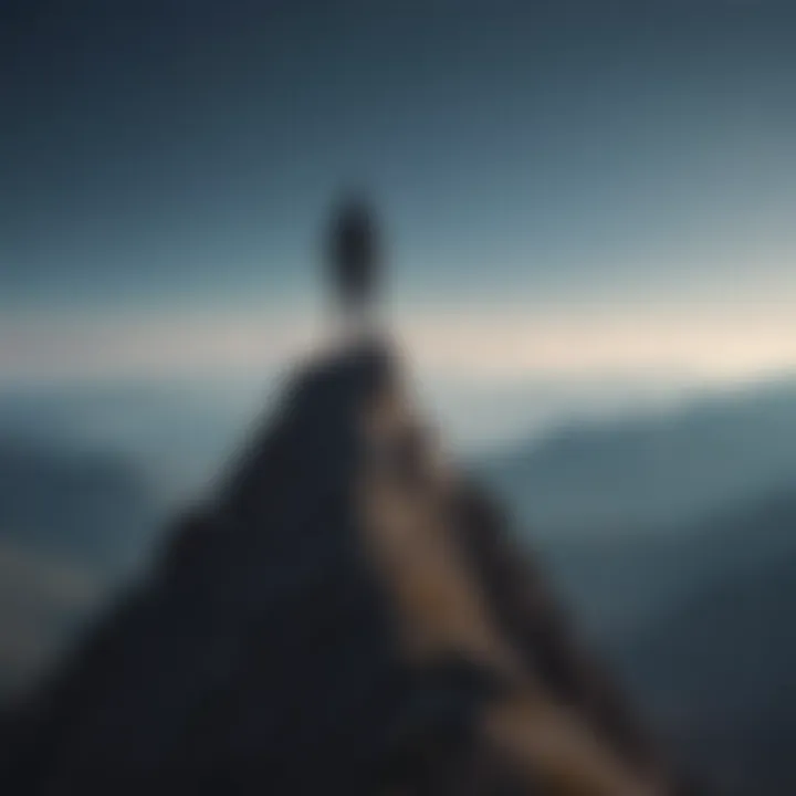 Silhouette of a person standing atop a mountain peak