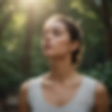 Person practicing deep breathing exercises in a serene outdoor environment