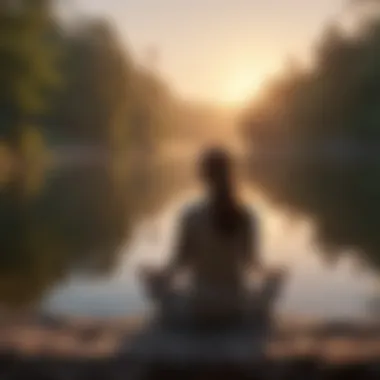 Person meditating by a peaceful lakeside at sunrise