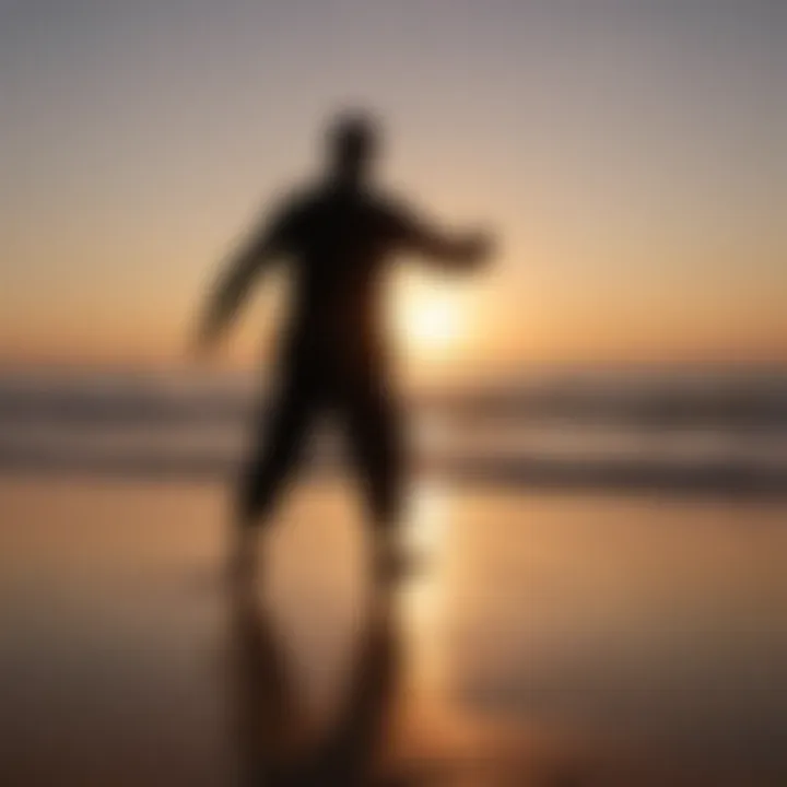 Silhouette of a person doing Tai Chi at sunset on a beach