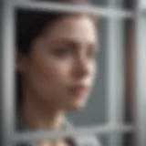 A person looking out a window, symbolizing feelings of confinement